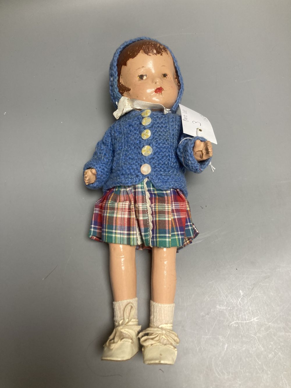 An Armand Marseille bisque boy doll, mould 990 with fixed glass eyes, 30cm, a bisque doll with jointed composition body, 47cm and a pai